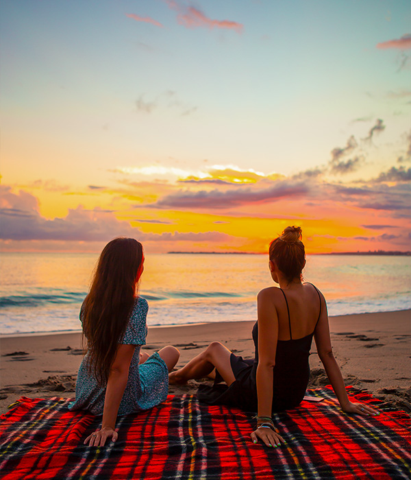 Women relaxing on beach